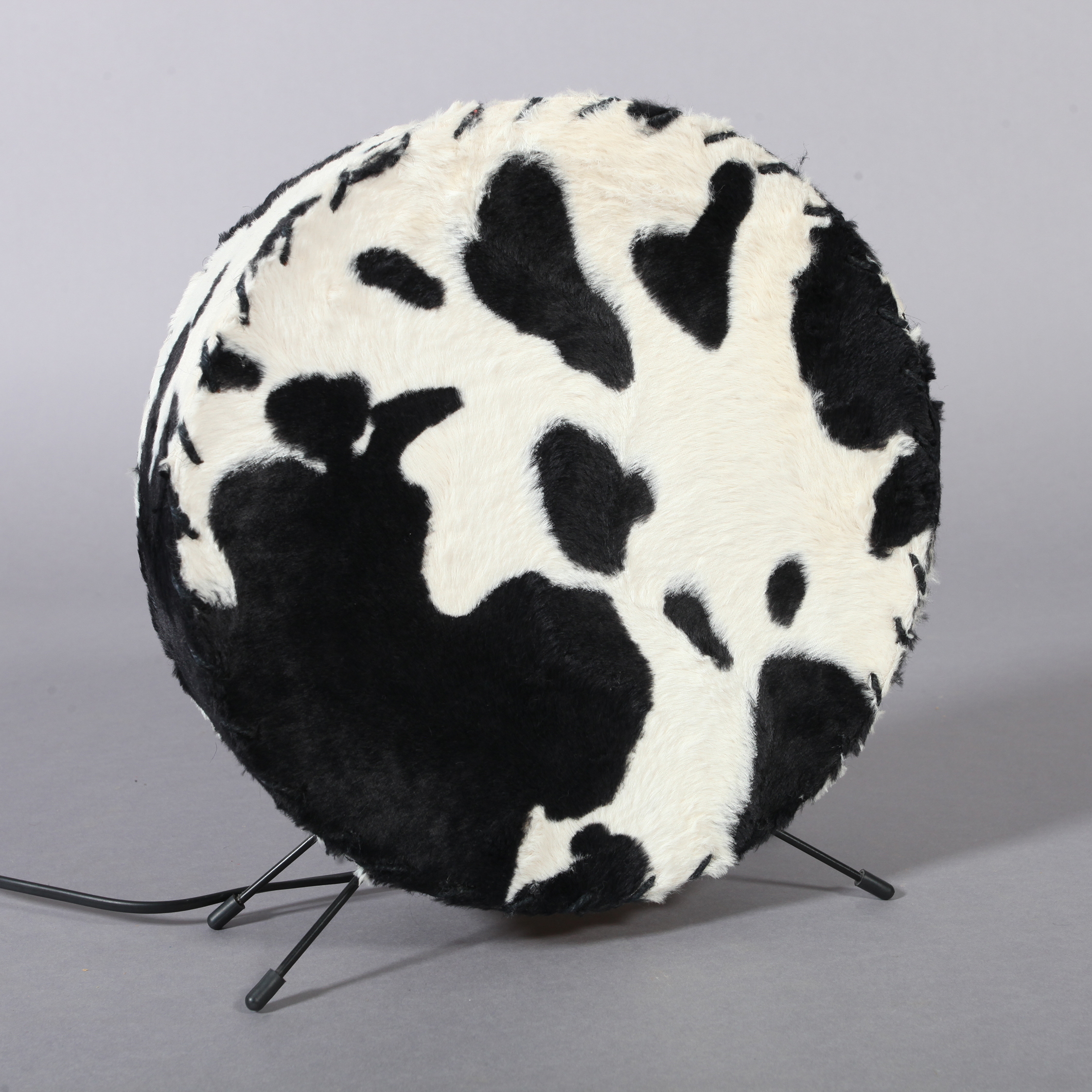 A black and white 'cow hide' table lamp, 32cm x 32cm