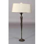 Porta Romana, a bronzed metal figural table lamp on circular spreading base complete with oval