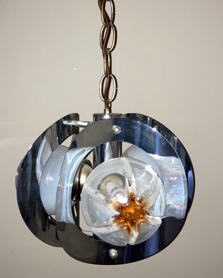 A French chromium plated light fitting of concave circular pierced discs fitted with moulded glass