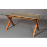 A pale elm and glass top dining table, rectangular on 'x' refectory supports, 180cm wide x 82cm deep
