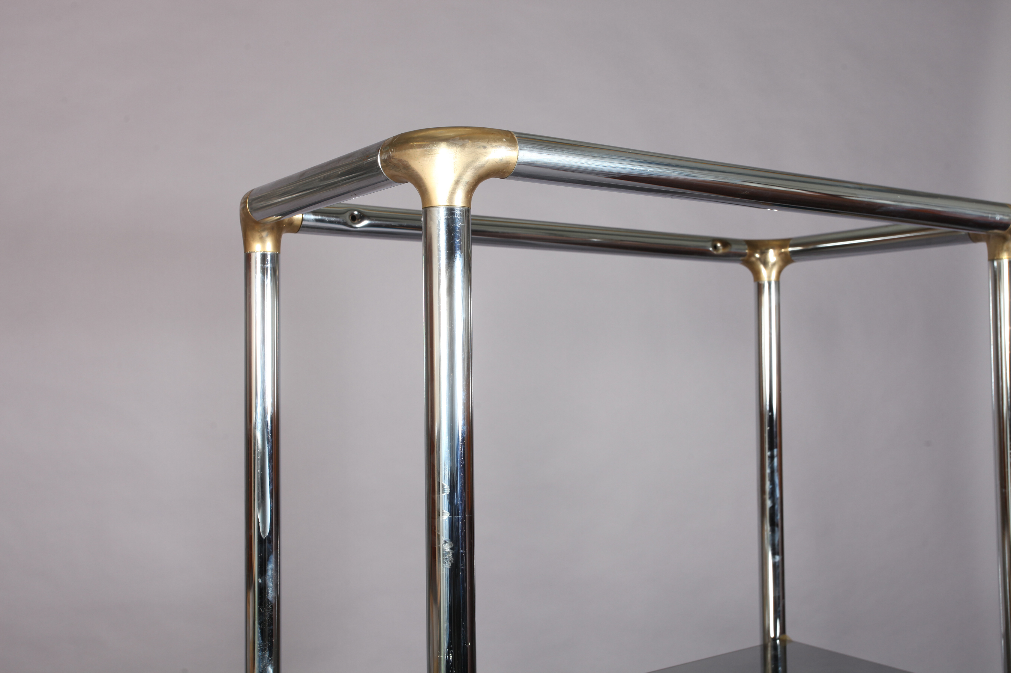 A chrome and gilt metal display stand with three smoked glass shelves, 84cm wide x 41cm deep x 183cm - Image 2 of 3
