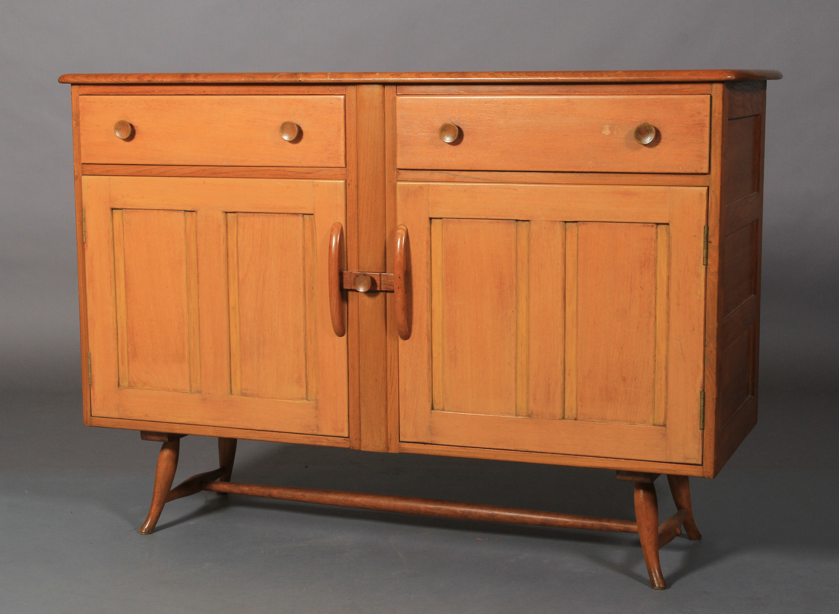 Ercol, a pale elm sideboard, c.1955/60 two frieze drawers above two twin indented panel cupboard - Image 2 of 5