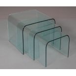 A nest of three curved glass tables, 50cm x 56cm x 45cm high