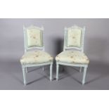 A pair of French style pale blue single chairs, the arched top rail with carved ribbon cresting,