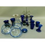 A collection of blue glass including beakers, vases, bottle and stopper, together a clear glass