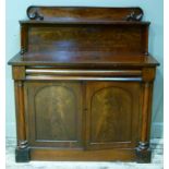 A Victorian mahogany chiffonier, the raised back having a shelf on turned uprights, a cushion