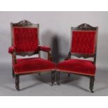 A pair of Victorian lady's and gent's armchairs, the buttoned backs, arms and seats upholstered in