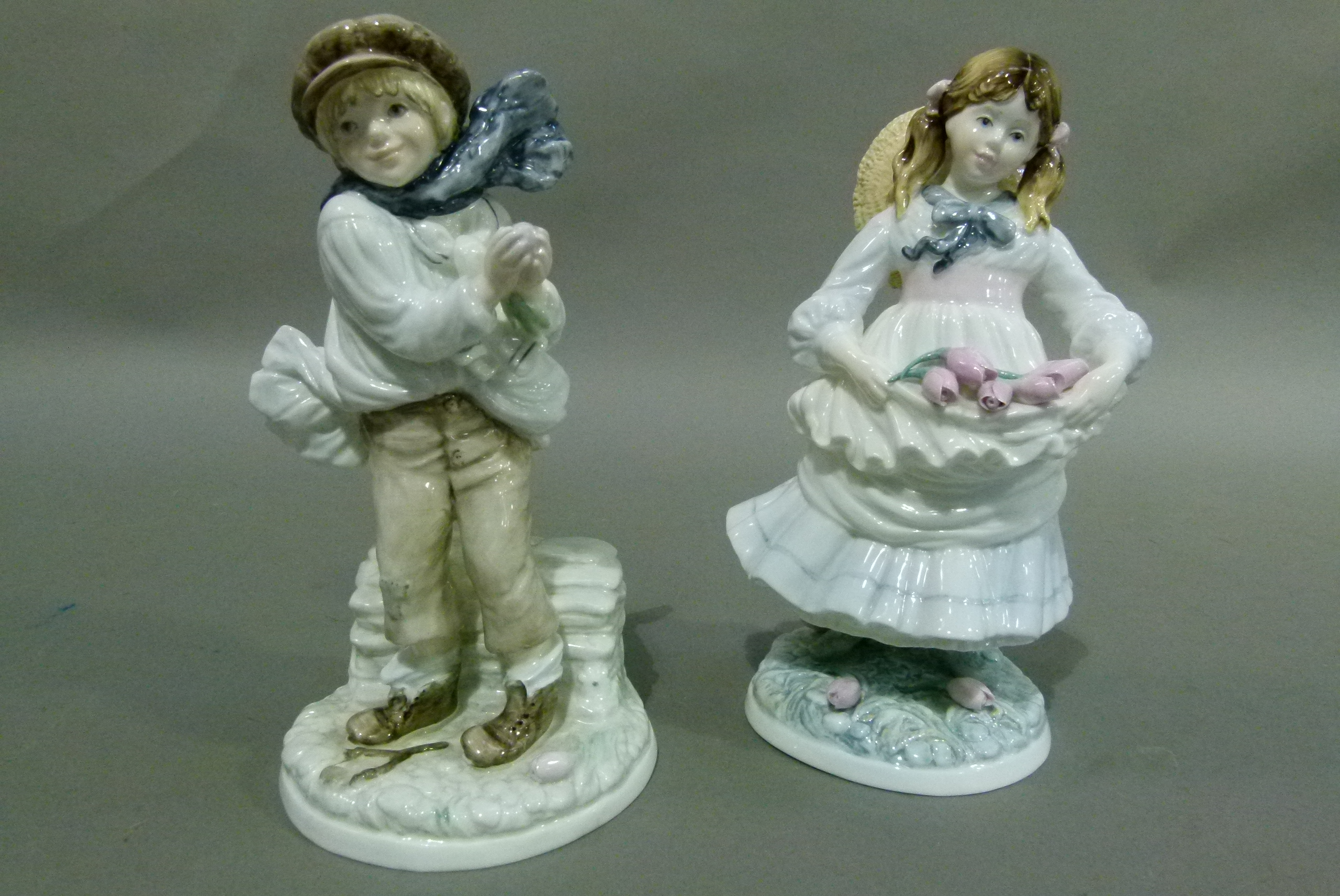 Two Coalport china figures, The Boy and Childhood Joys, issued to commemorate The National