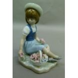 A Lladro figure Picking Flowers, code 1287, year 1974, 16cm high