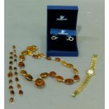 A suite of Baltic amber necklace and pair of bracelets in base metal wire together with a lady's