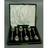 A set of six George V silver teaspoons, the tear shaped terminals fret cut with stylised leaves,