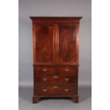 A George III style figured mahogany linen press with dental moulded flared cornice the upper section