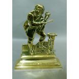 A Victorian brass door porter modelled as a man holding a violin, on stepped rectangular base,