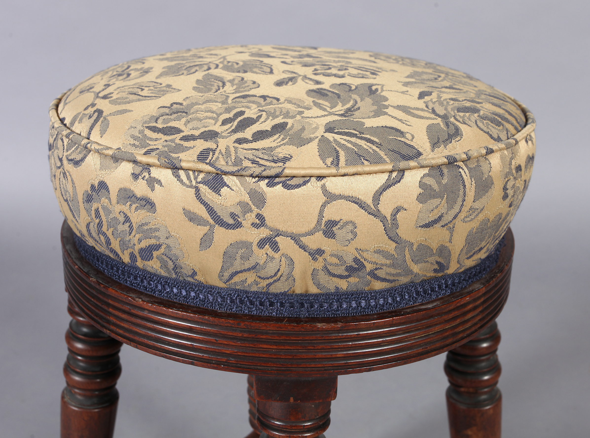 A post Regency mahogany revolving circular music stool, the stuffed over top with reeded rim, four - Image 2 of 3