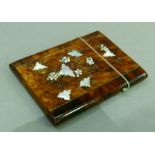 A 19th century tortoiseshell veneered calling card case inlaid in mother-of-pearl and steel wire