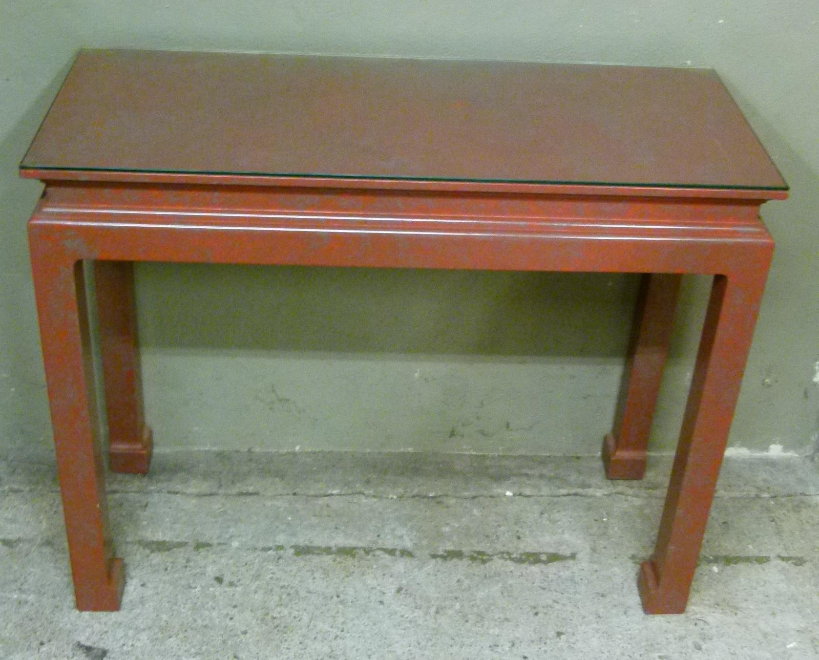 A Chinese style console table painted in grey and red marble effect with glass top, 91cm wide x 36cm