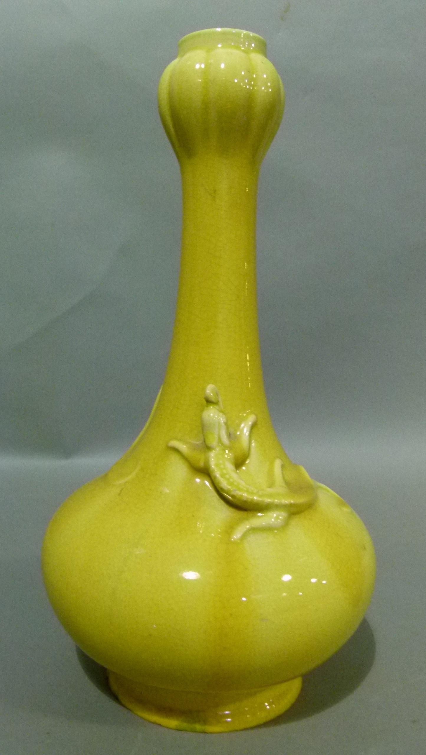 A Chinese crackle yellow glazed vase of baluster form with tall neck relief moulded with a pair of