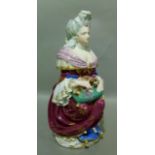 A Jacob Petit style two part jug modelled as a lady in 18th century dress with dog upon a cushion,