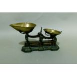 A Victorian set of weighing scales by H Webb and Co Birmingham, brass pans, to weigh one pound,