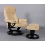 A Stressless armchair upholstered in cream leather together with a matching footstool