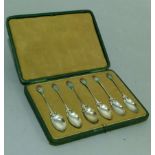 A set of six Edward VII silver and enamel teaspoons in Art Nouveau style with bud finials in