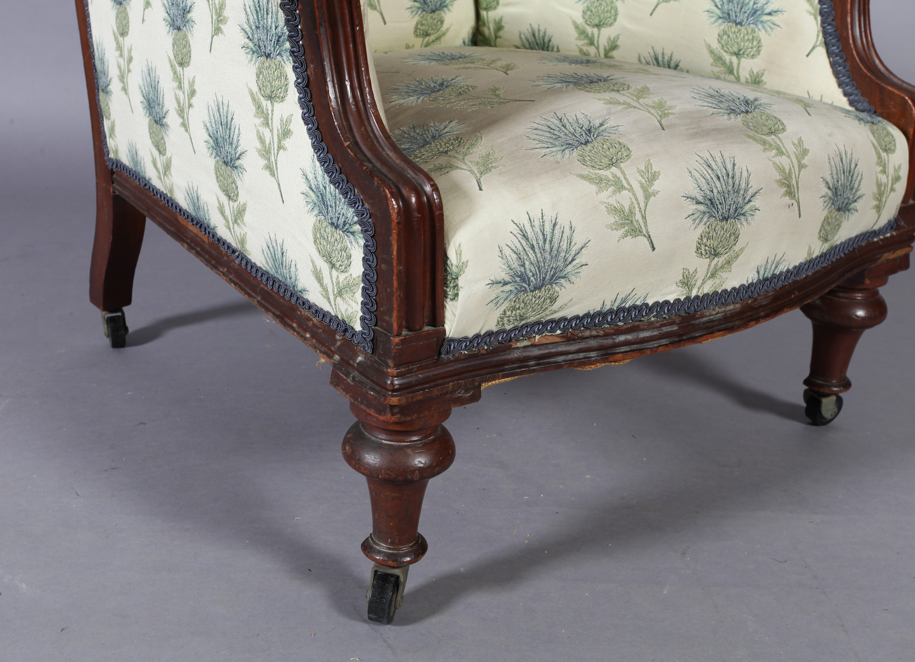 A Victorian mahogany framed elbow chair with upholstered scroll over back and arms, the bowed feet - Image 5 of 5