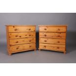 A pair of reproduction pine four drawer chests on turned legs, 75cm x 73cm high