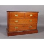 A walnut chest of drawers, the rectangular top above two short and two long drawers with recessed