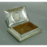 A sterling standard cigarette box, the slightly domed hinged lid centred on a Dutch 2½ gilder coin