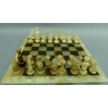 An alabaster chess set with onyx chess board