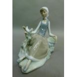 A Lladro shepherdess with dove, code 4660, year 1969, 17cm high