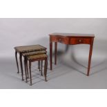 A reproduction mahogany serpentine side table, cross banded and box wood strung, the frieze fitted