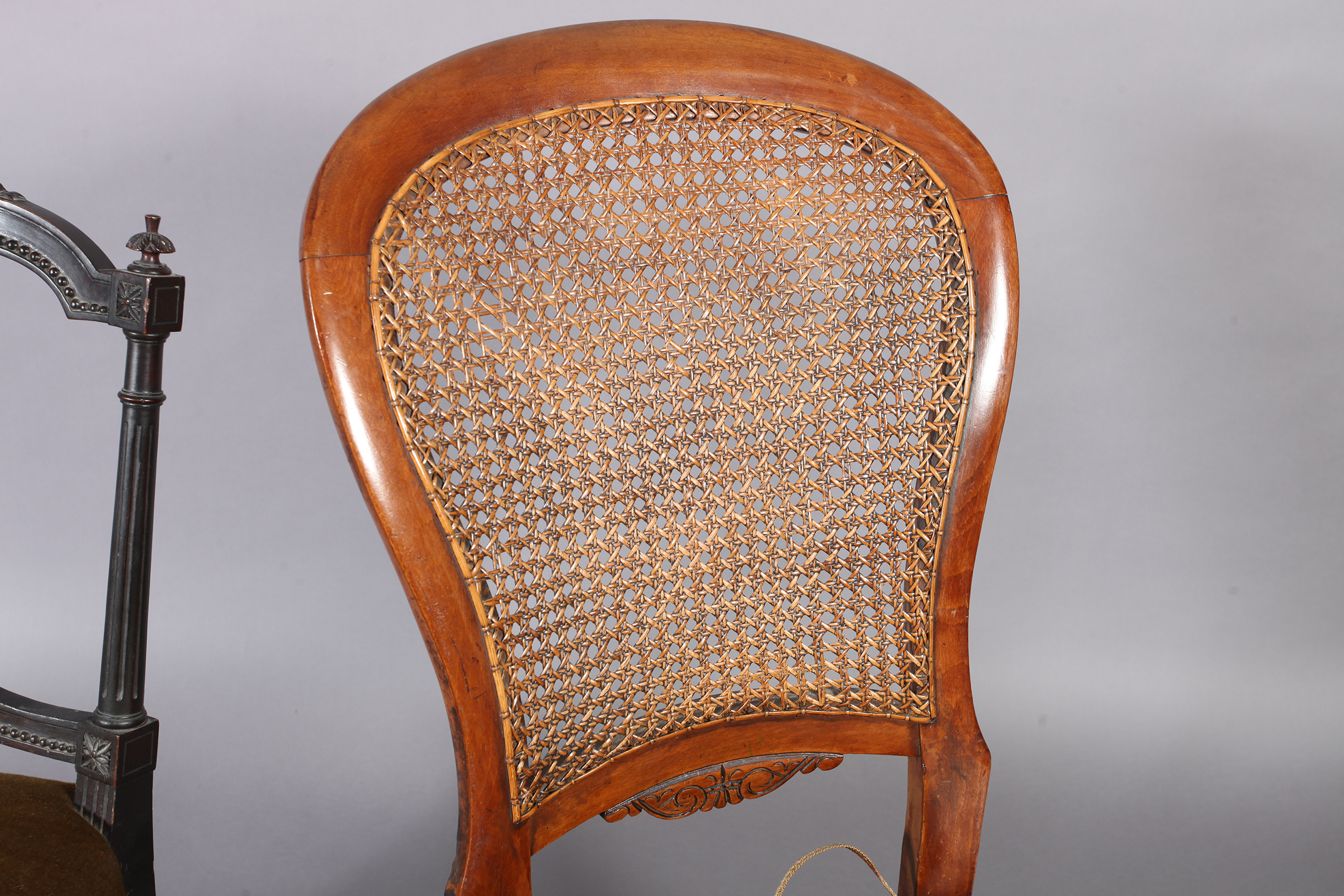 A Victorian walnut framed rocking chair, the back with caned panel above a velvet seat, turned - Image 3 of 4