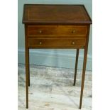 An Edwardian mahogany and boxwood strung work table rectangular having a lift up top above a dummy