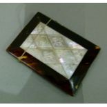 A 19th century mother-of-pearl veneered calling card case with central panels of engraved mother-