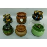 Two marble ware tobacco jars and four others of various design