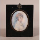 English School, early 19th century portrait of a young woman, bust length, her hair dressed with a