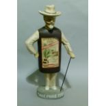 An advertising figure for Myers's Rum, male figure with hat and cane with paper label, the