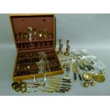 A canteen of gilt metal and teak handled cutlery complete with an array of servers, together with