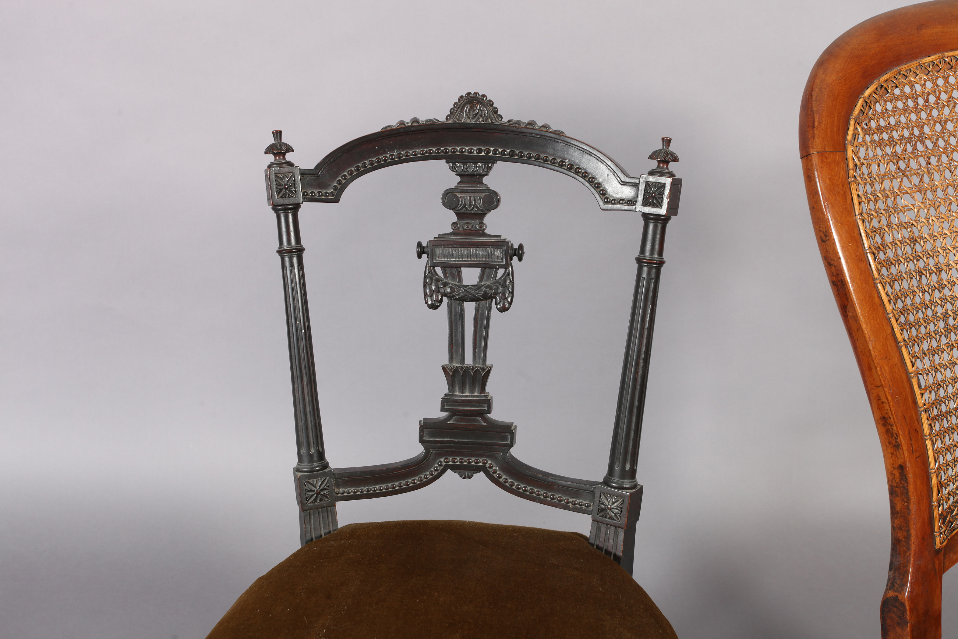 A Victorian walnut framed rocking chair, the back with caned panel above a velvet seat, turned - Image 2 of 4