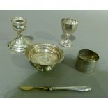 A silver eggcup, ribbon tied foliate engraved swags initialled PAB; together with an engine turned