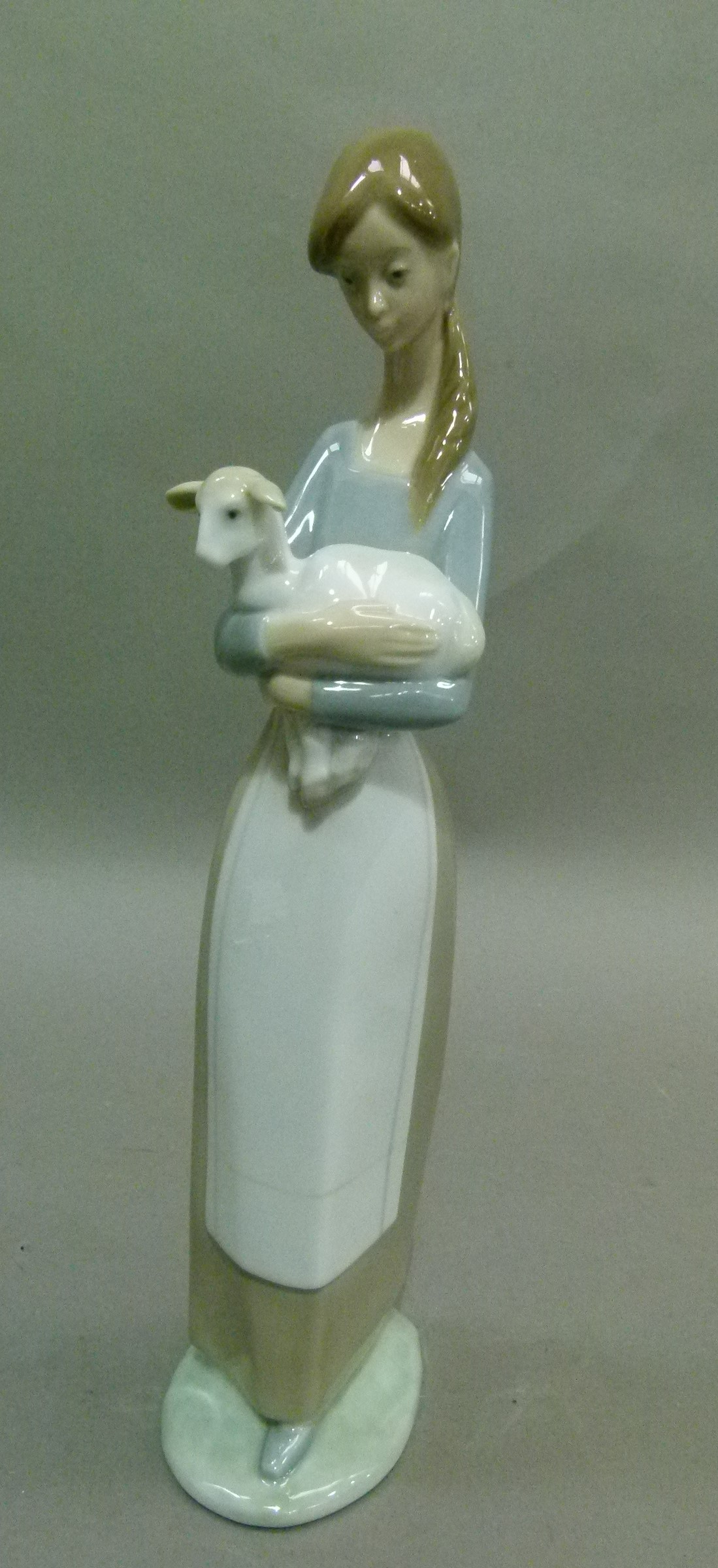 A Lladro girl with lamb, code number 4505, year 1969, 26cm high