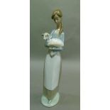 A Lladro girl with lamb, code number 4505, year 1969, 26cm high