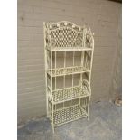 A reproduction painted wrought iron folding four tier stand with serpentine shaped top, pierced with