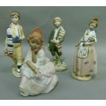Four various Nadal hand made Spanish figures, one sitting and three standing