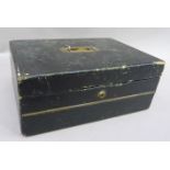 A Victorian black leather and brass writing box having an inset handle to the cover, the interior