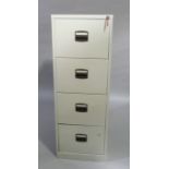 A four drawer grey metal filing cabinet with key