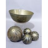 A modern Chinese brass bowl containing four hardwood bowls applied with Wrythen brass strapwork of