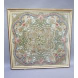 A needlework panel circa 1900, worked in rose, blue, green, with fruiting branches, blossom and