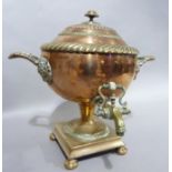 A 19th century copper two handled tea urn with domed and fluted cover, brass spigot on a domed